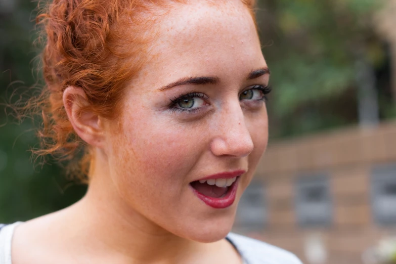 a close up of a woman with red hair