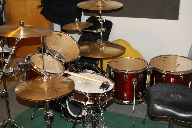 an assortment of musical instruments lined up on a carpet