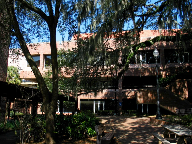 an outside courtyard with a few tables and trees