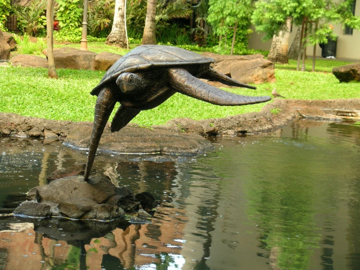 a statue of an elephant in the water