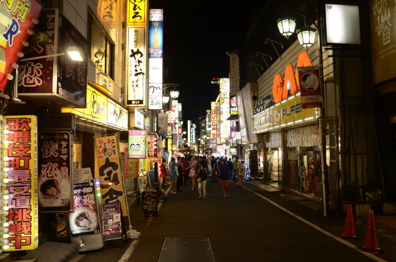 there is a city street in asia with many colorful signs