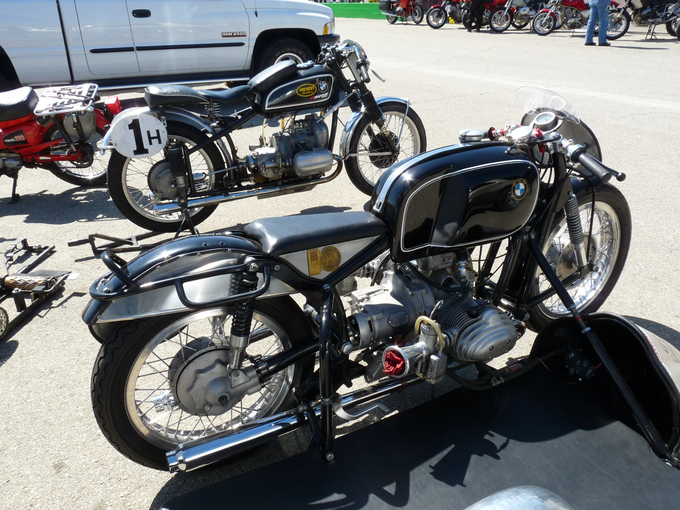 a motorcycle parked next to another bike at a fair