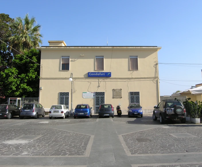 a building with a number of cars parked on the front of it