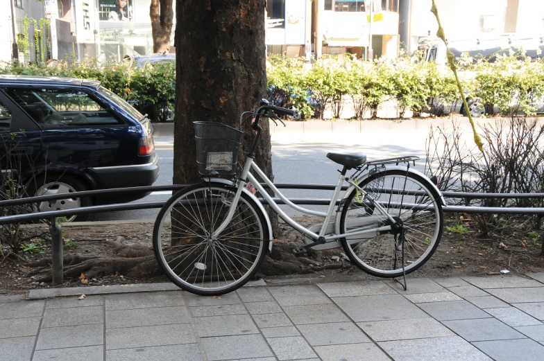 a bicycle is  to a metal pole