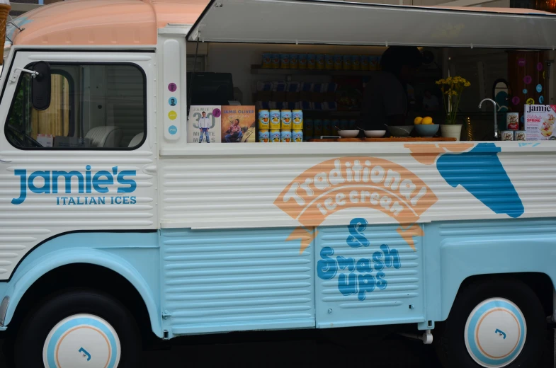 a food truck with some bottles on top