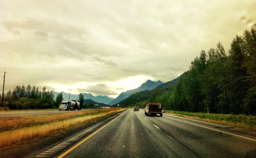 a truck and some cars on the road