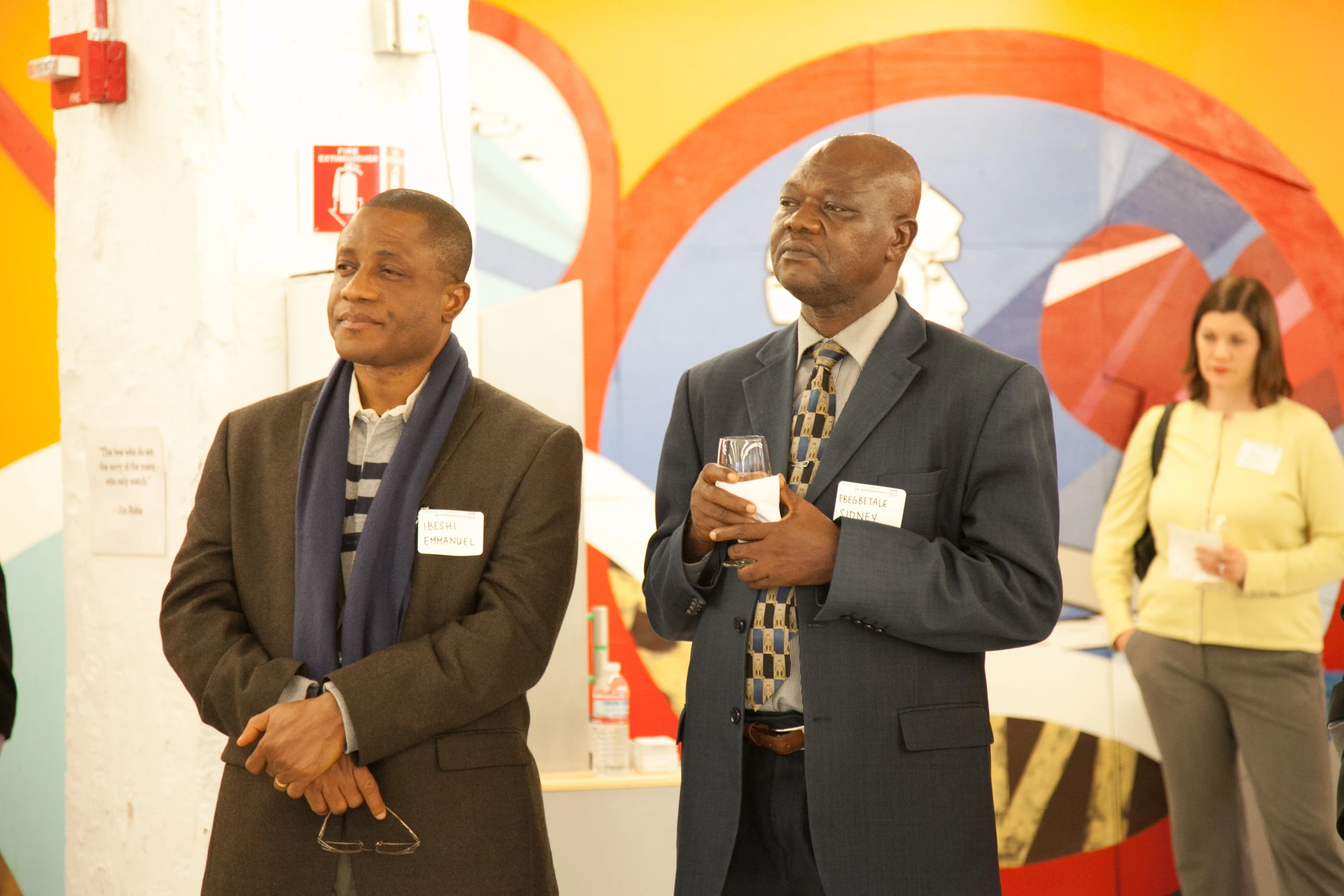 men are wearing ties and stand next to each other