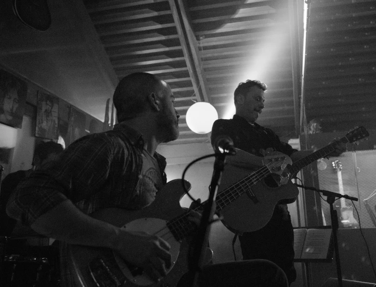 a couple of young men are playing a concert