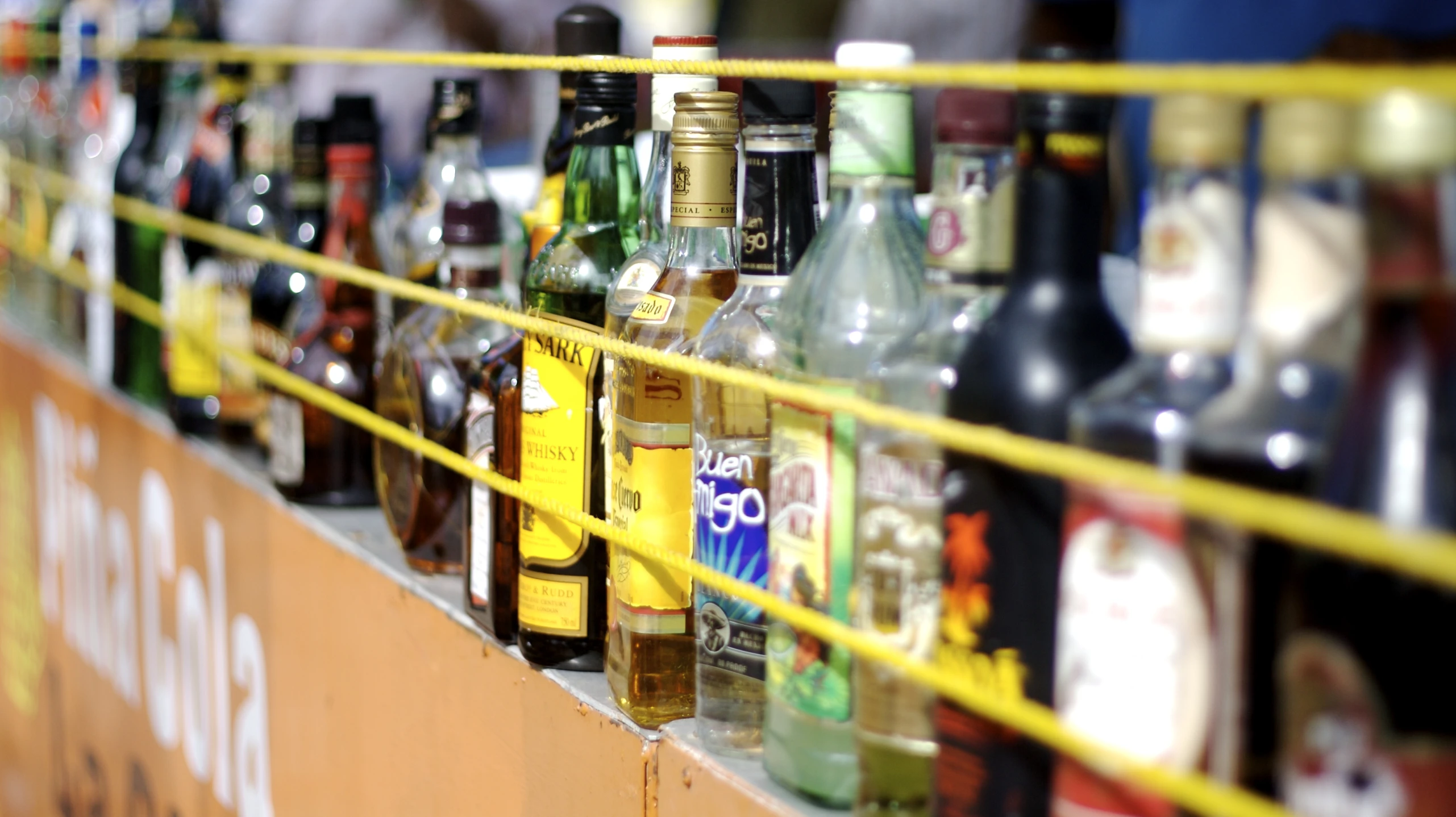 a group of liquor bottles are lined up on a table