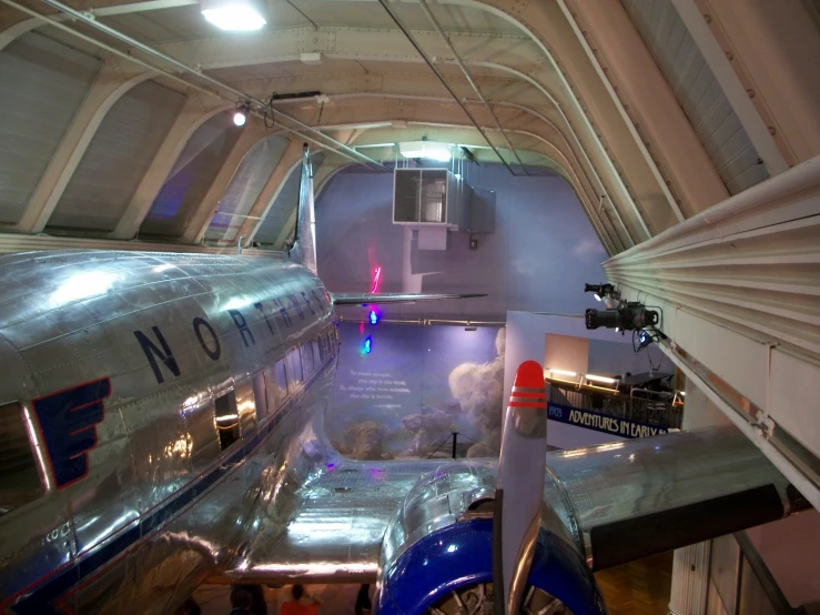 the inside of an airplane with people around