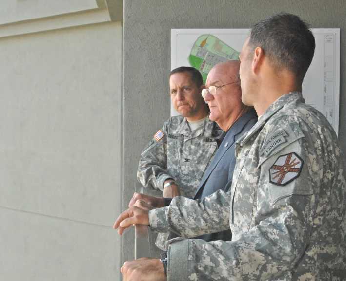 a group of men standing around each other