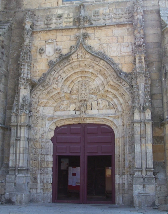 an entrance to a large brick building