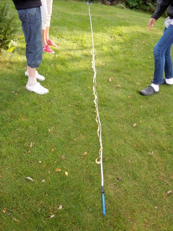 two s playing with a small plastic toy kite