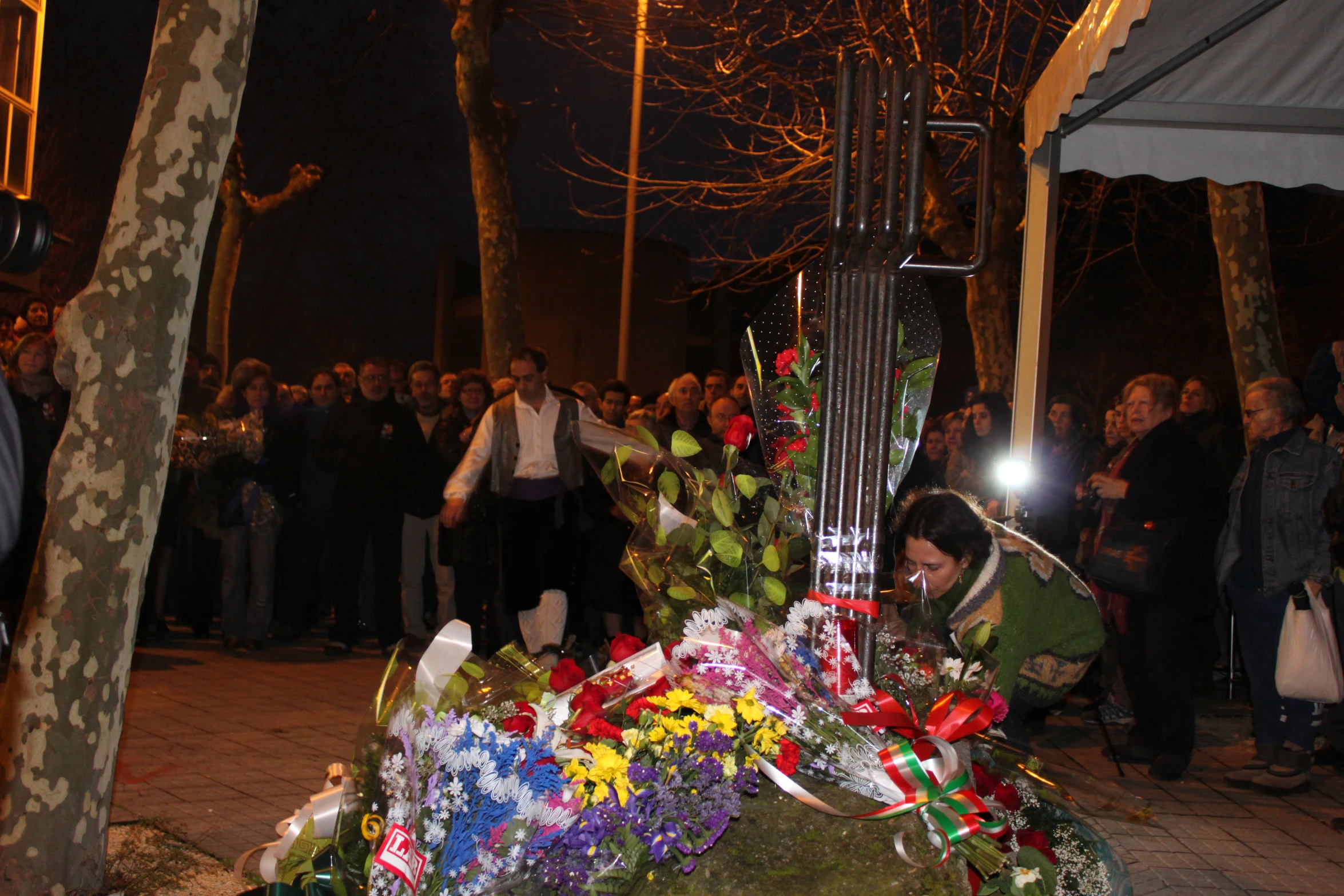 a group of people gathered next to a guitar