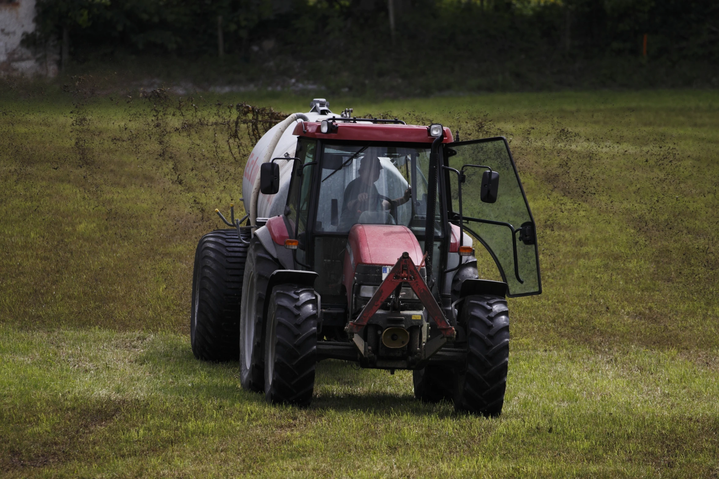 a tractor is parked on the grass