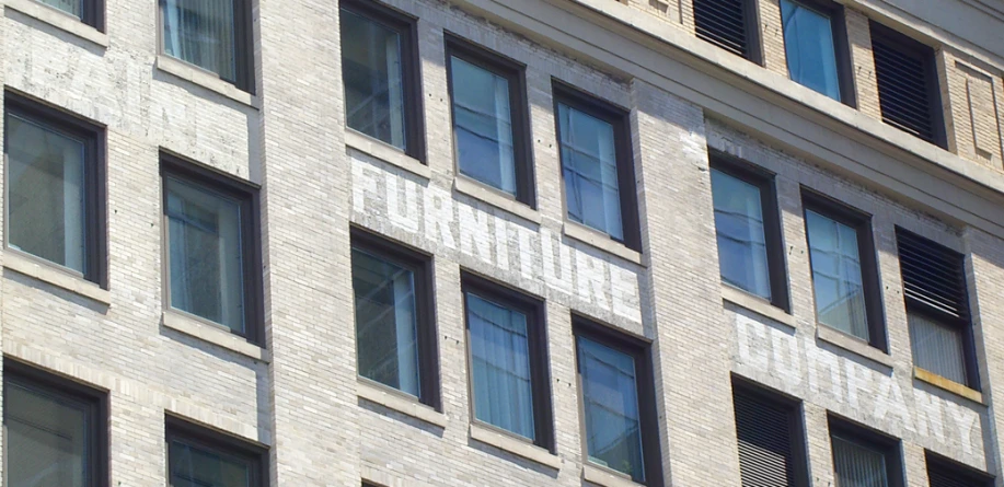 a large building with windows on one side and the name columbus on the other