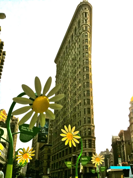 a large building with a giant yellow flower