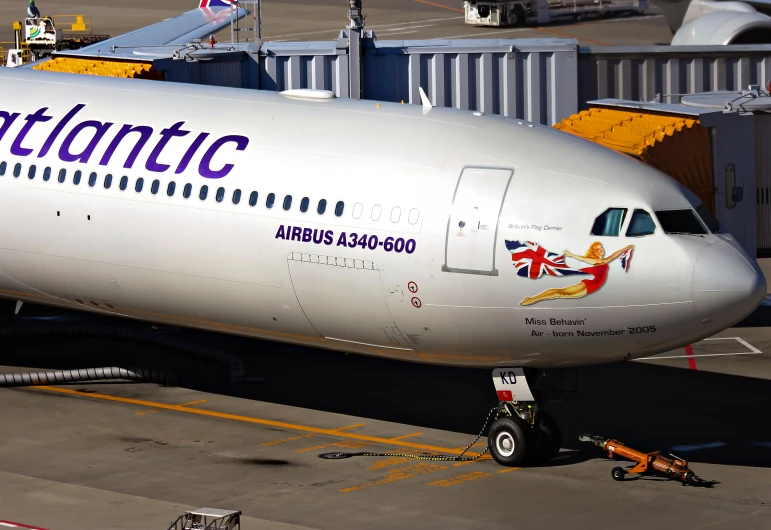 the large airplane is next to an airport platform