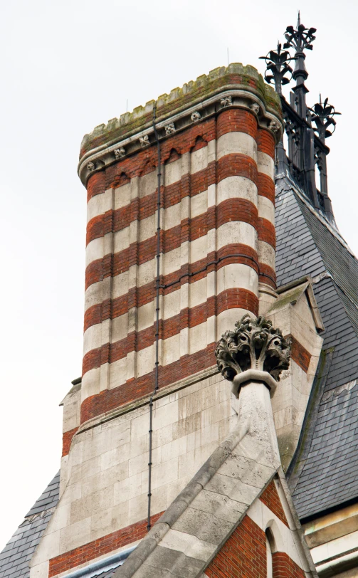 a picture of an old building that has two ornate gargoyles on it