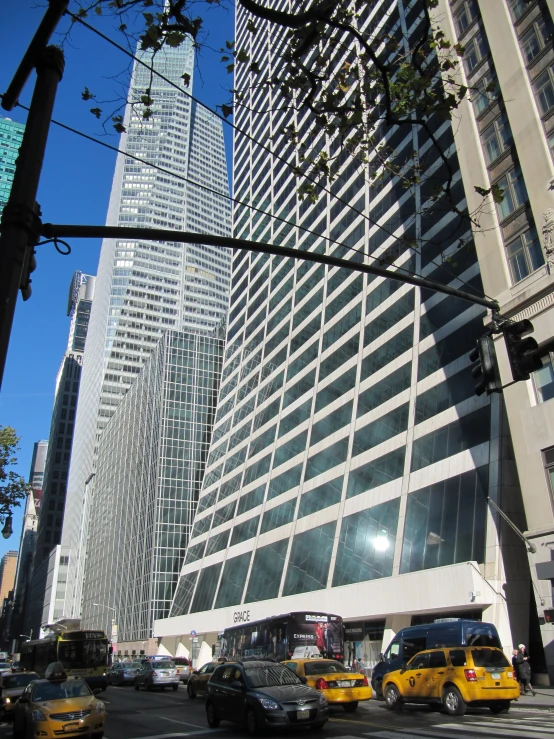 an intersection in front of buildings with traffic on it