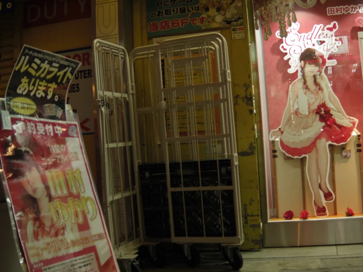 a display window with a mannequin and other items