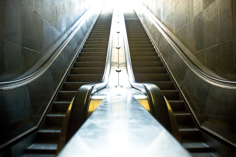 the escalators are very large with the sun shining down