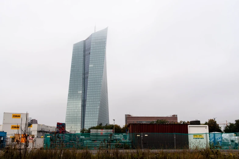 an urban building in front of construction machinery