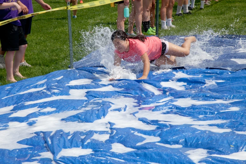 there is a small child riding a surf board