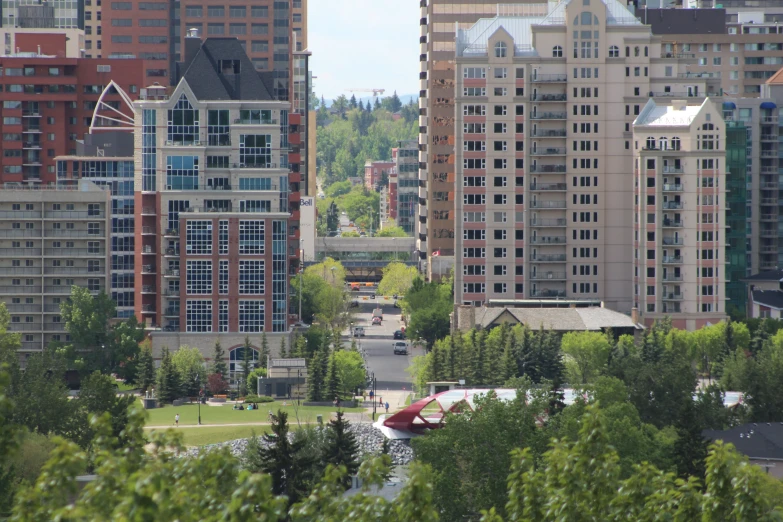 a bunch of tall buildings and some trees