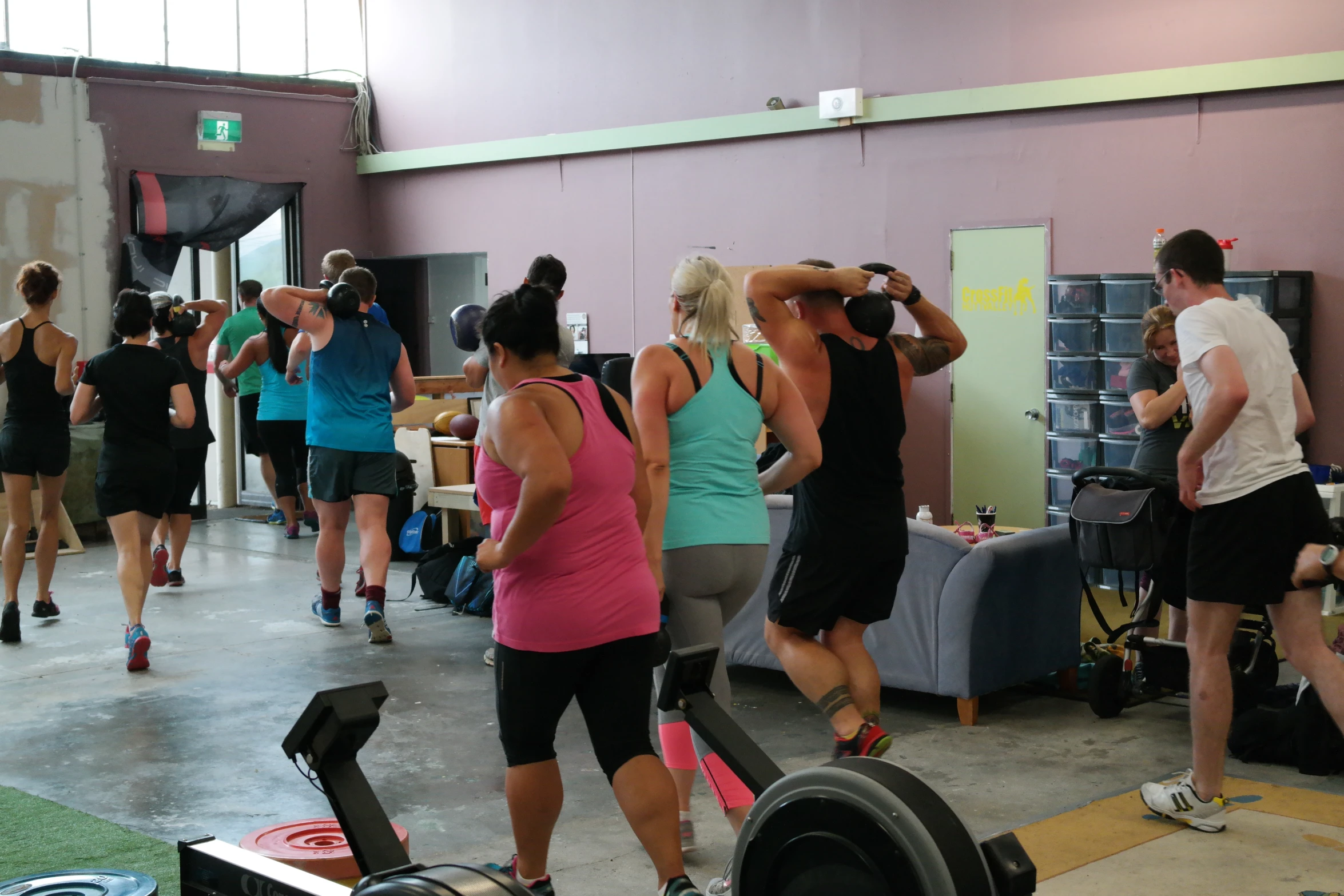 a group of people working out in a gym