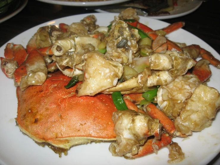 a crab with green peppers and other vegetables