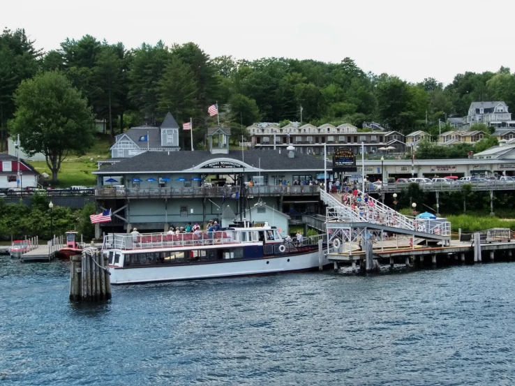 a large cruise ship on the water near a dock