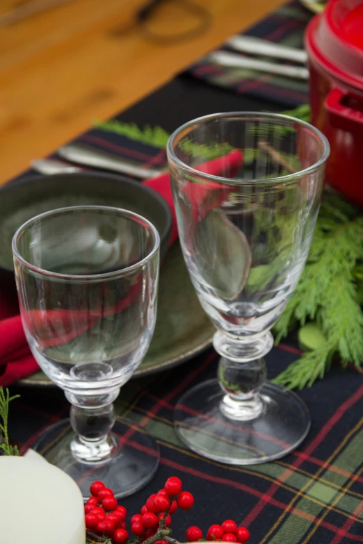 two glasses are sitting on a place mat