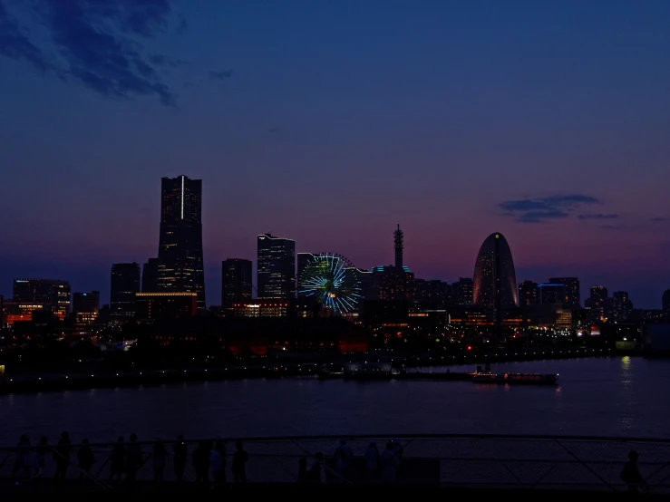 view of a city from across the river with a few boats