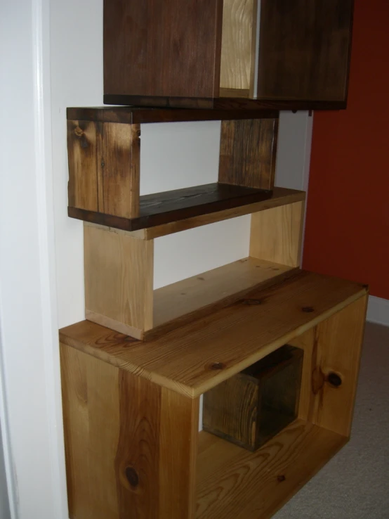 some wood boxes on top of a shelf
