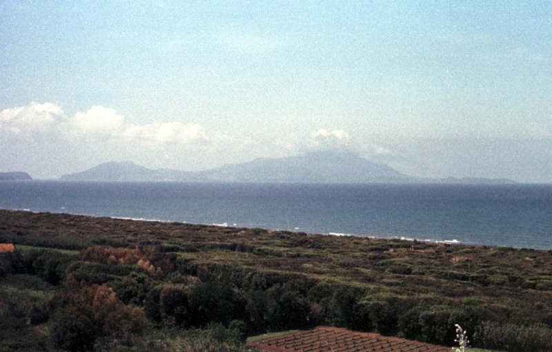 a lighthouse on the shore of a large body of water