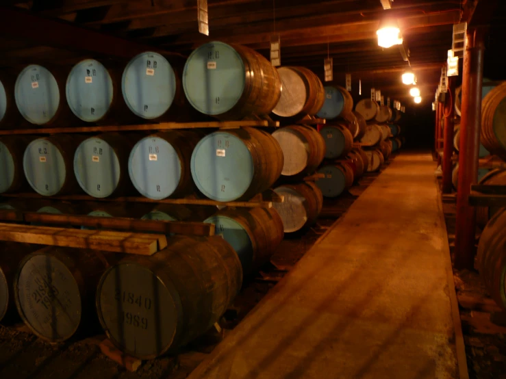 a room full of barrels stacked high in the air