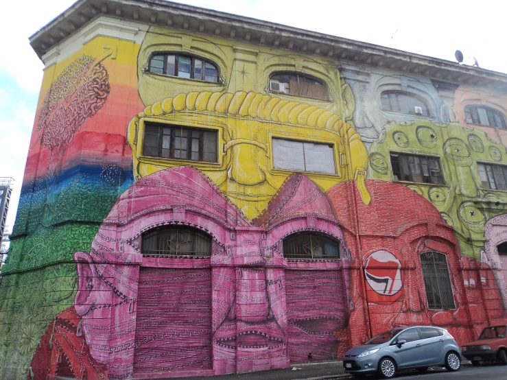 there is a large building with a very colorful wall