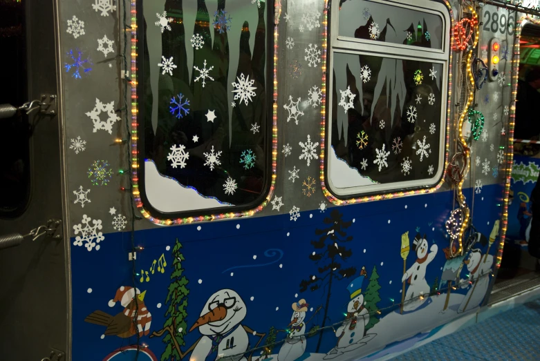 a very elaborate looking train that has snowmen on it