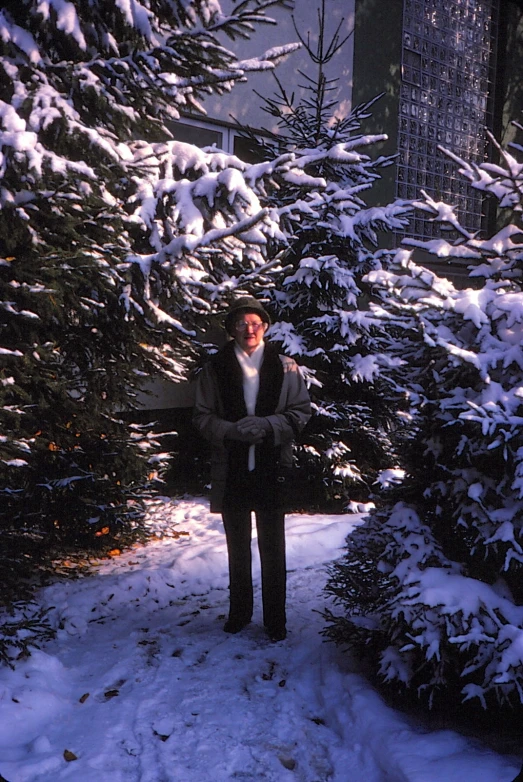 a person that is standing in the snow