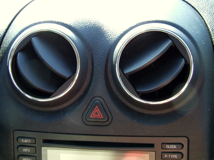 an older model car radio in a vehicle