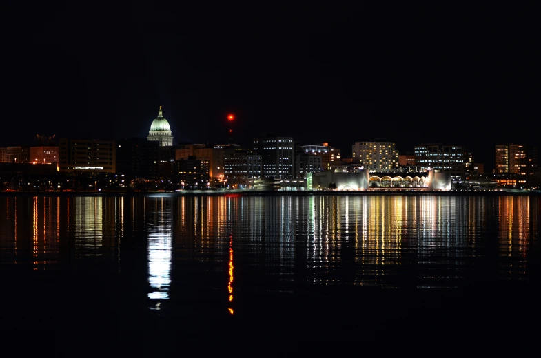 a city that has some buildings at night