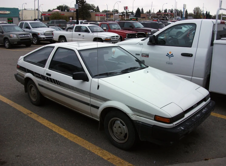 there is a white car parked in the lot