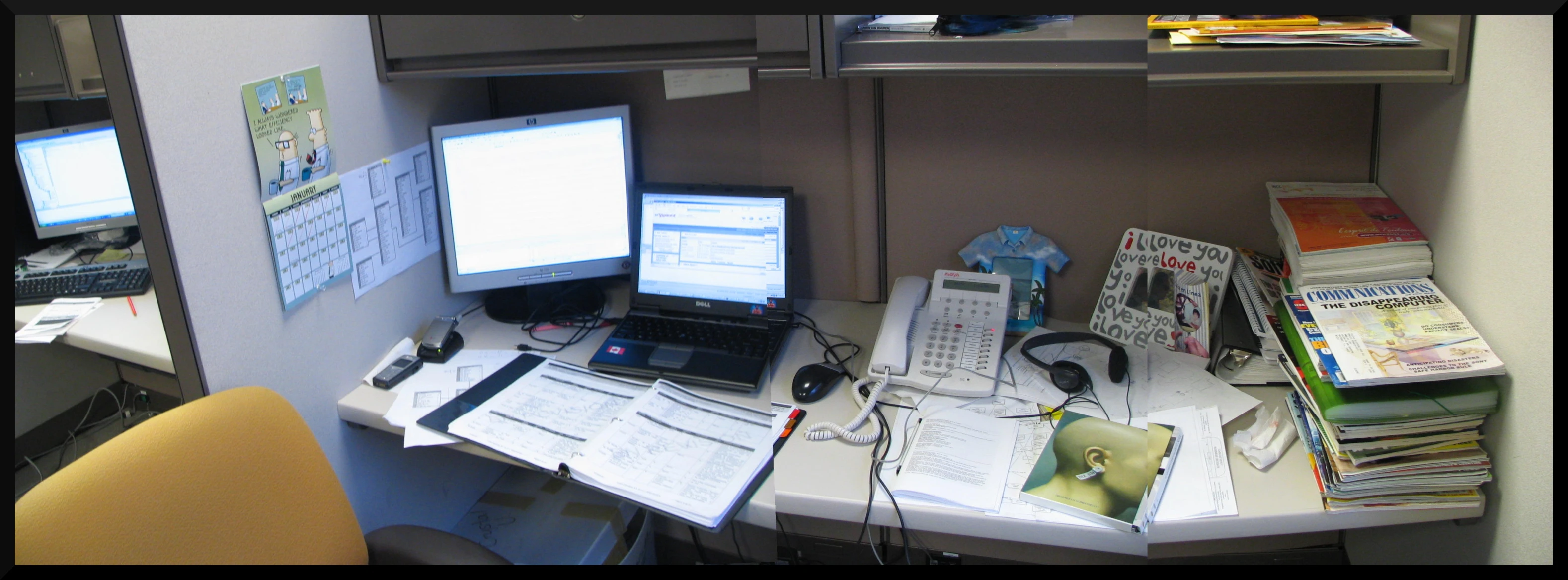 this is a computer desk with papers and other papers on it