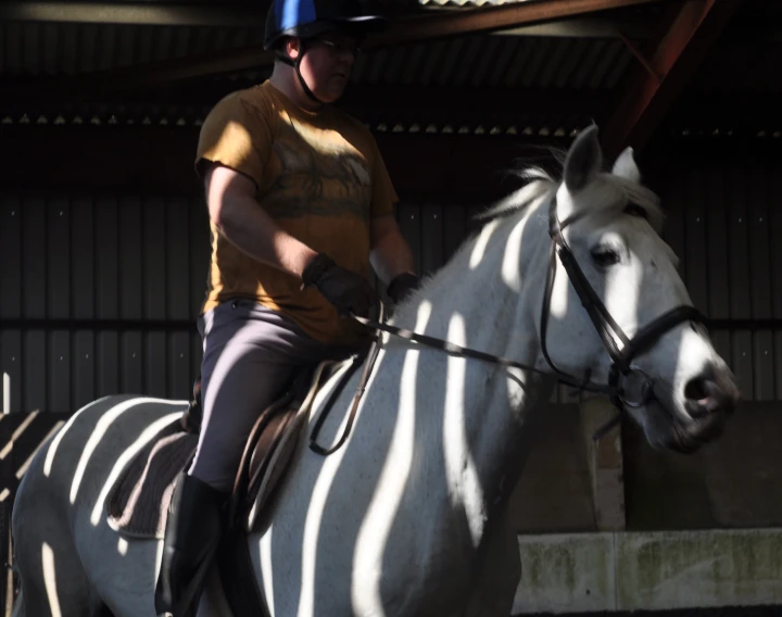 a man is riding on top of a horse