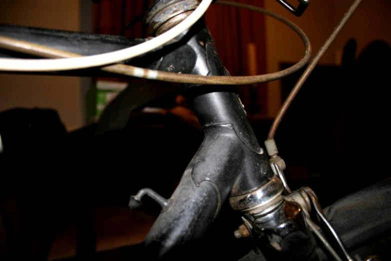 there is a black bike handlebar and some wires