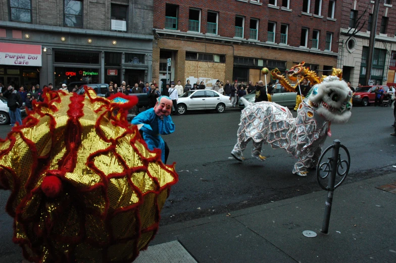 a street filled with lots of people watching performers