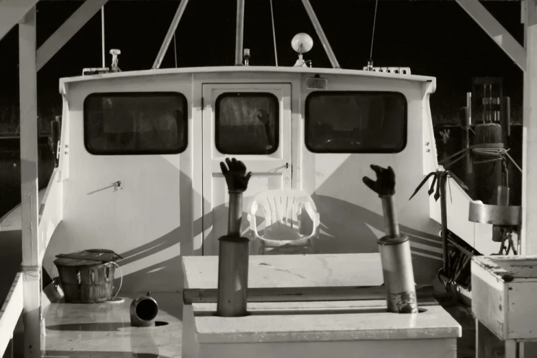 there are black and white pictures of the back side of the boat