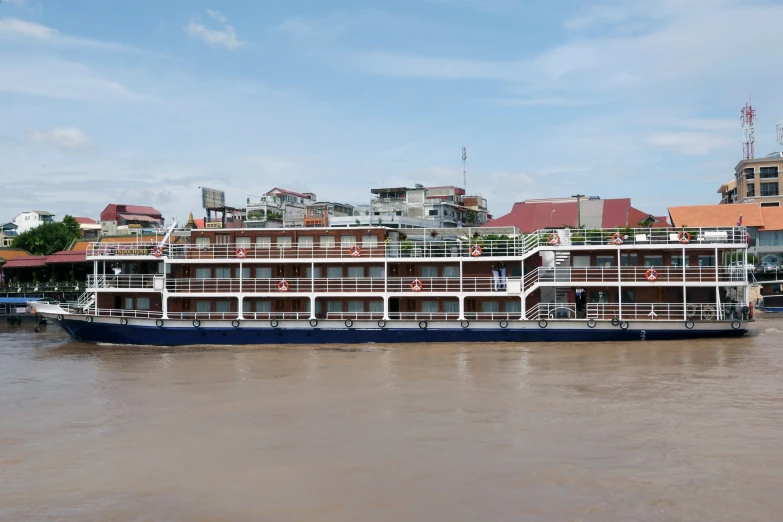 a boat sits in the water next to buildings