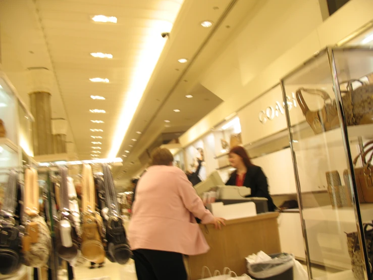 a women's store with a glass door and counter